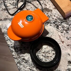 Dash Orange Mini Pie Maker with dough cutter